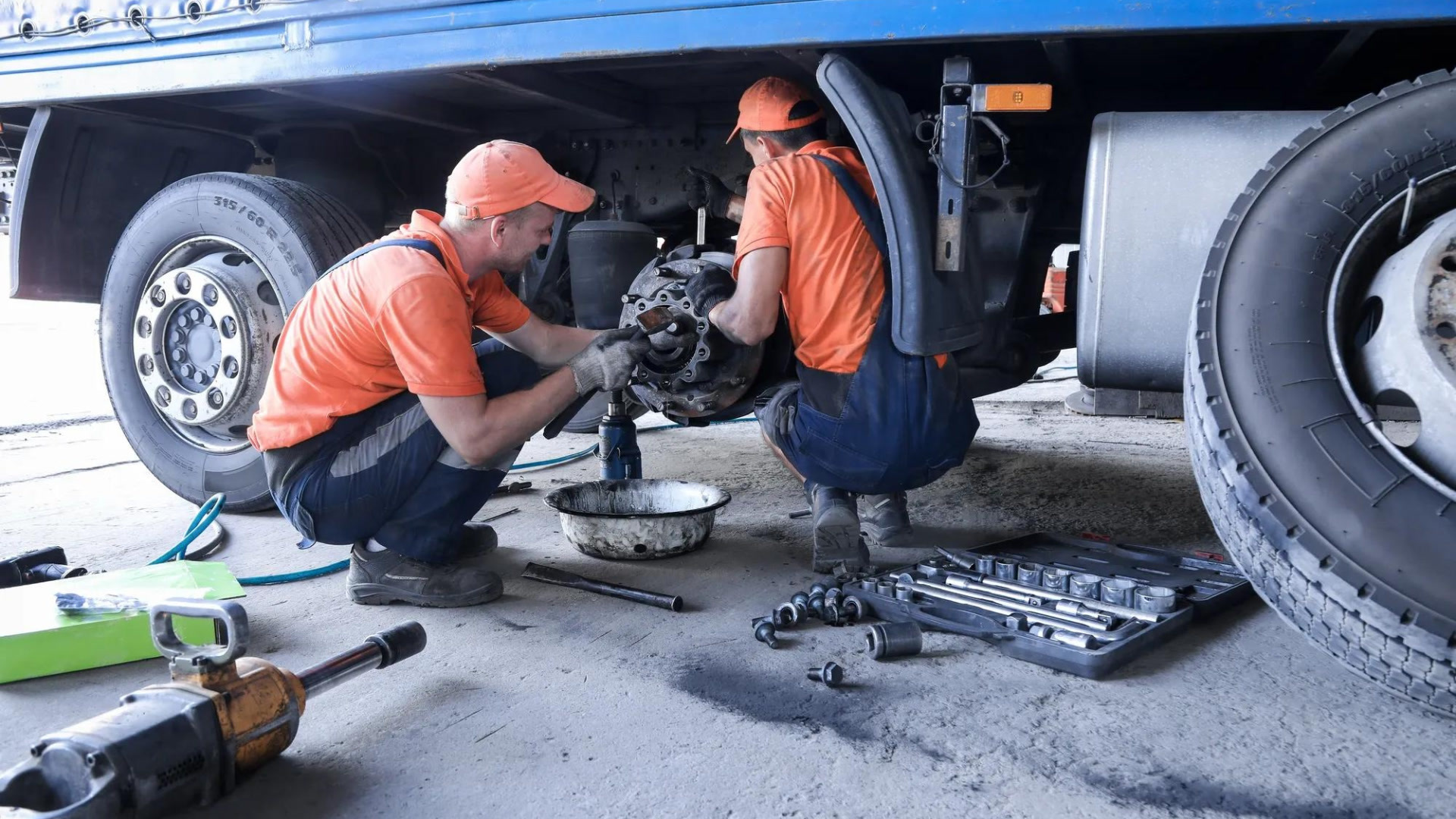 two people working on a truck