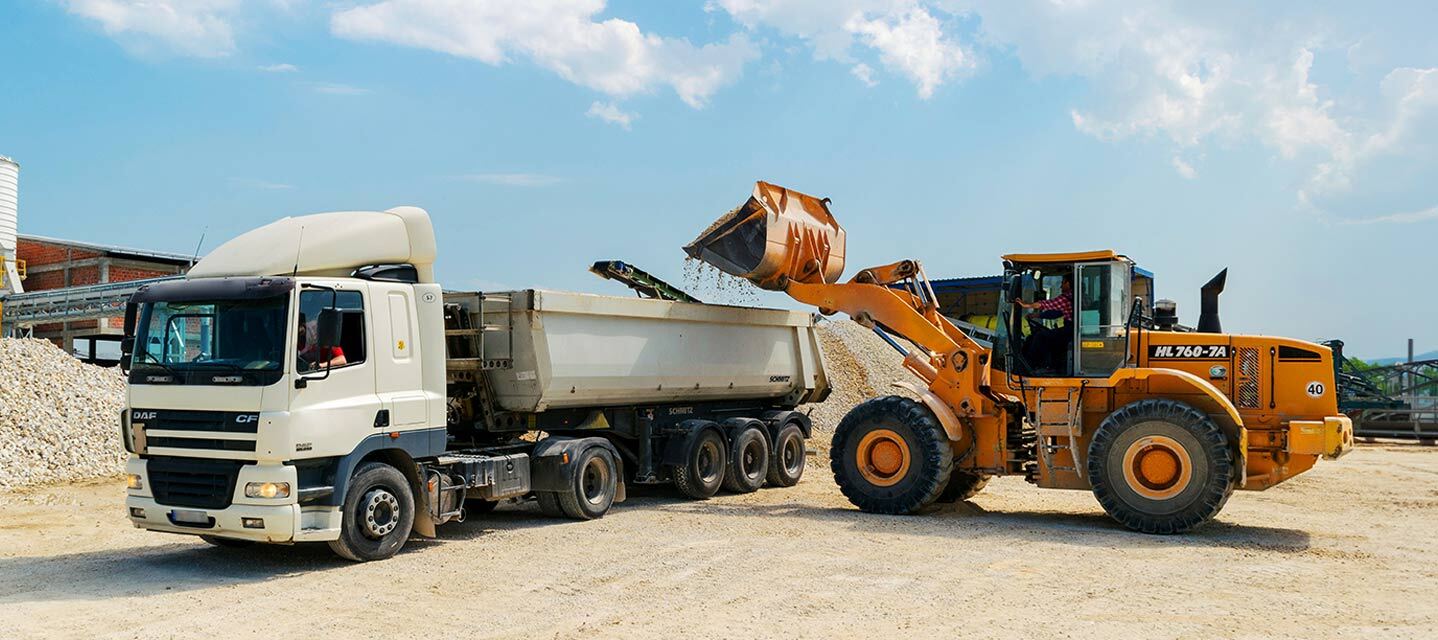White and yellow heavy equipment telematics vehicles.