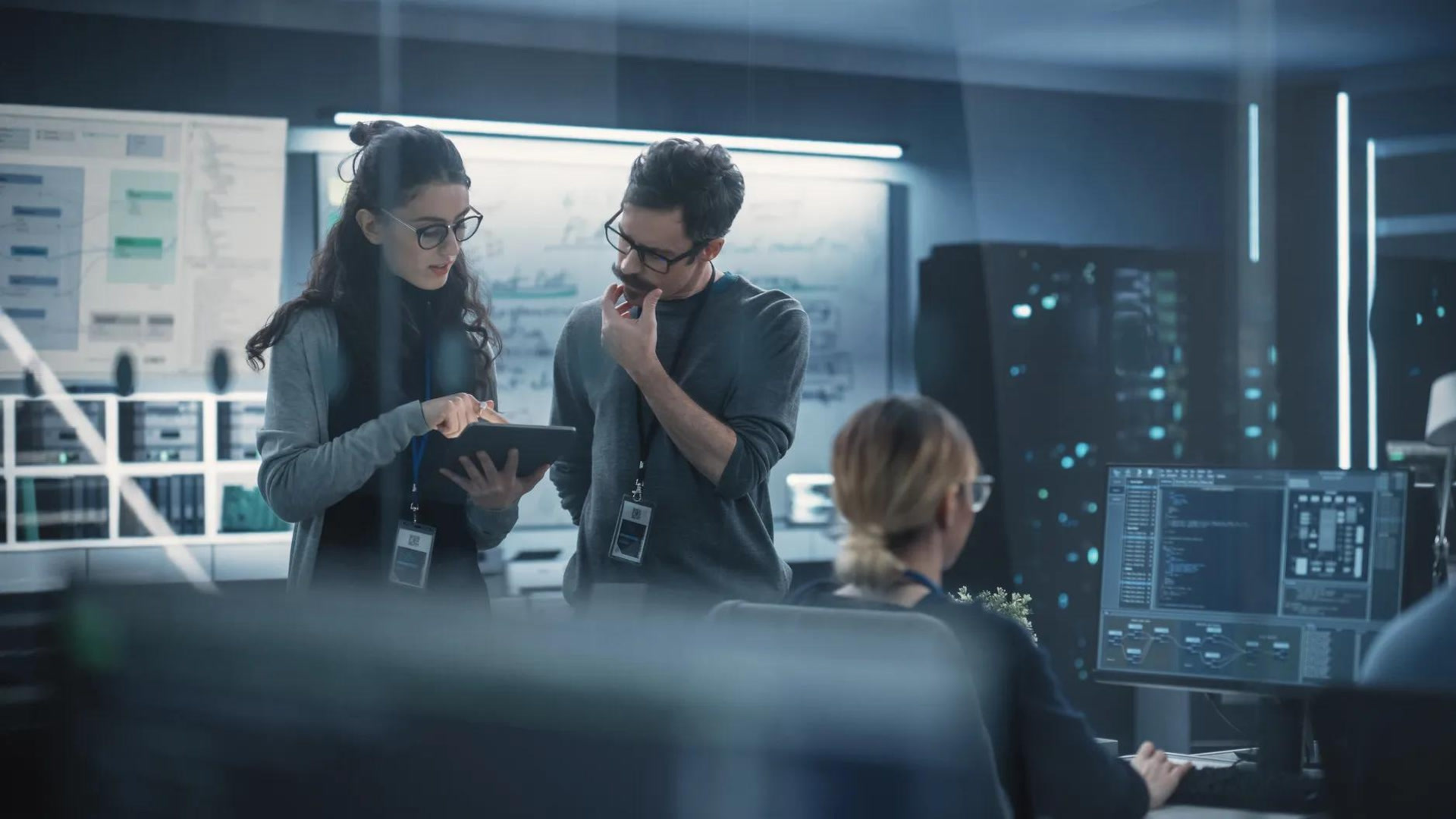 people talking in a server room