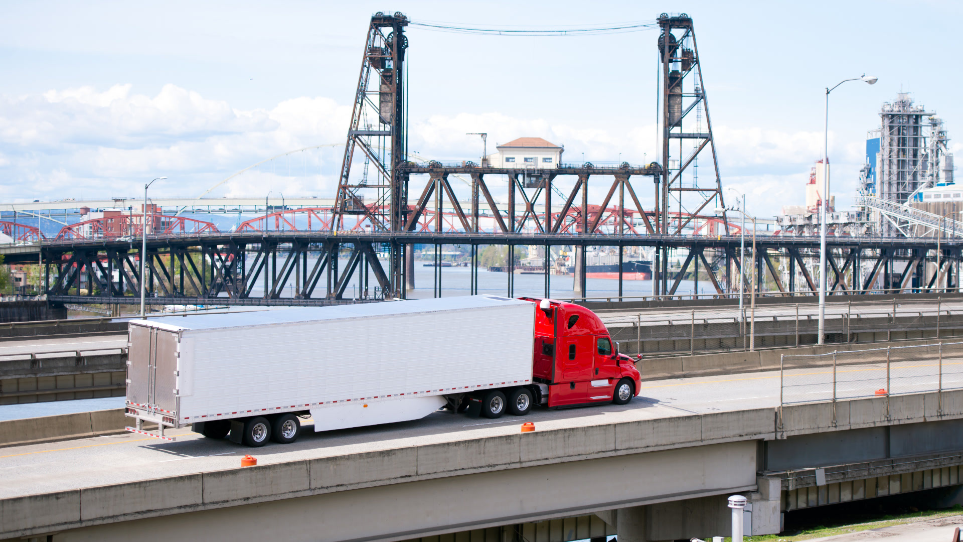 Commercial truck on a highway using integrated, truck-safe navigation built into a fleet management platform.