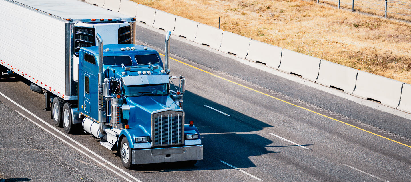 photo of modern refrigerated trailer on a highway, featuring a digital overlay of a mobile app dashboard showing real-time temperature gauges