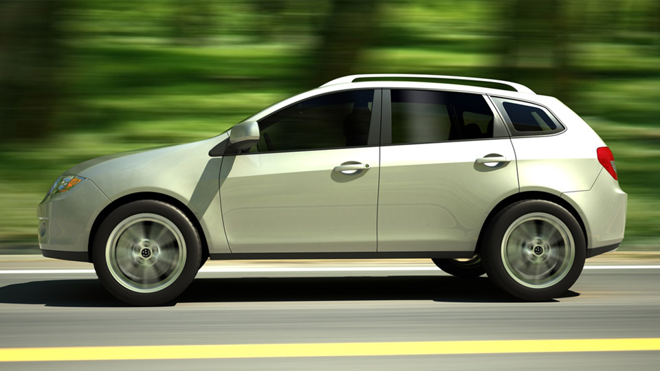 image of a green car on the road