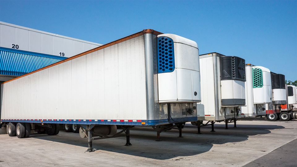 A row of trailers at a loading dock