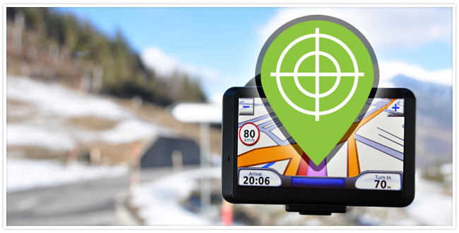 A GPS device with a target notification on the screen and a road in the background