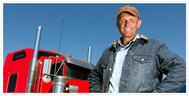 A man posing in front of a red semi truck