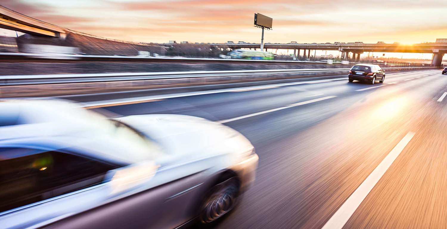 car driving fast on high way