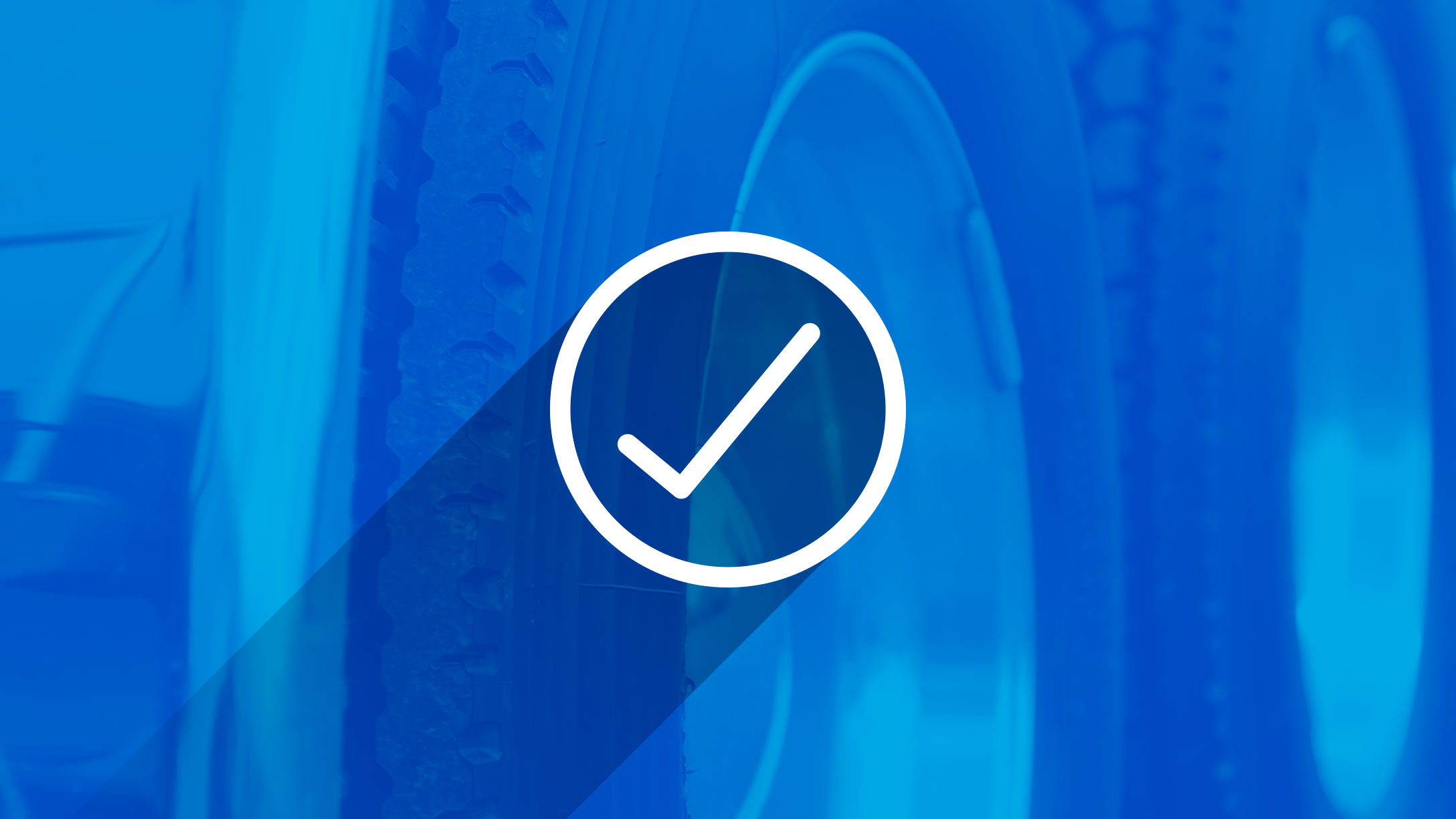 Check mark in front of a blue background of vehicle tires
