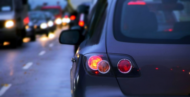 Image of vehicle on a road with oncoming traffic in other left lane