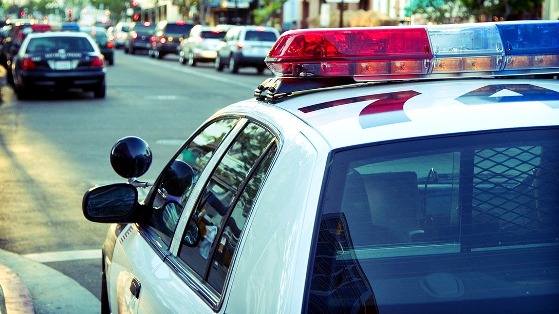 Cop car on parked on the side of the road