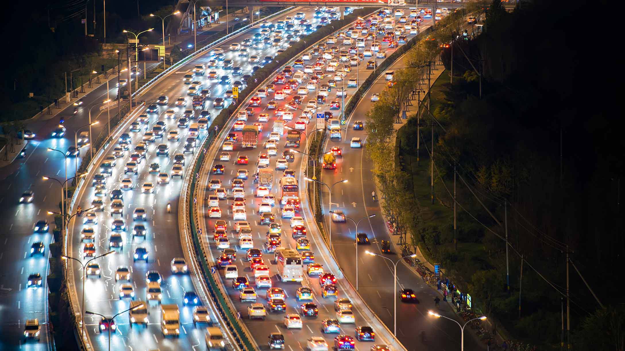 Birds eye view of a busy highway at night