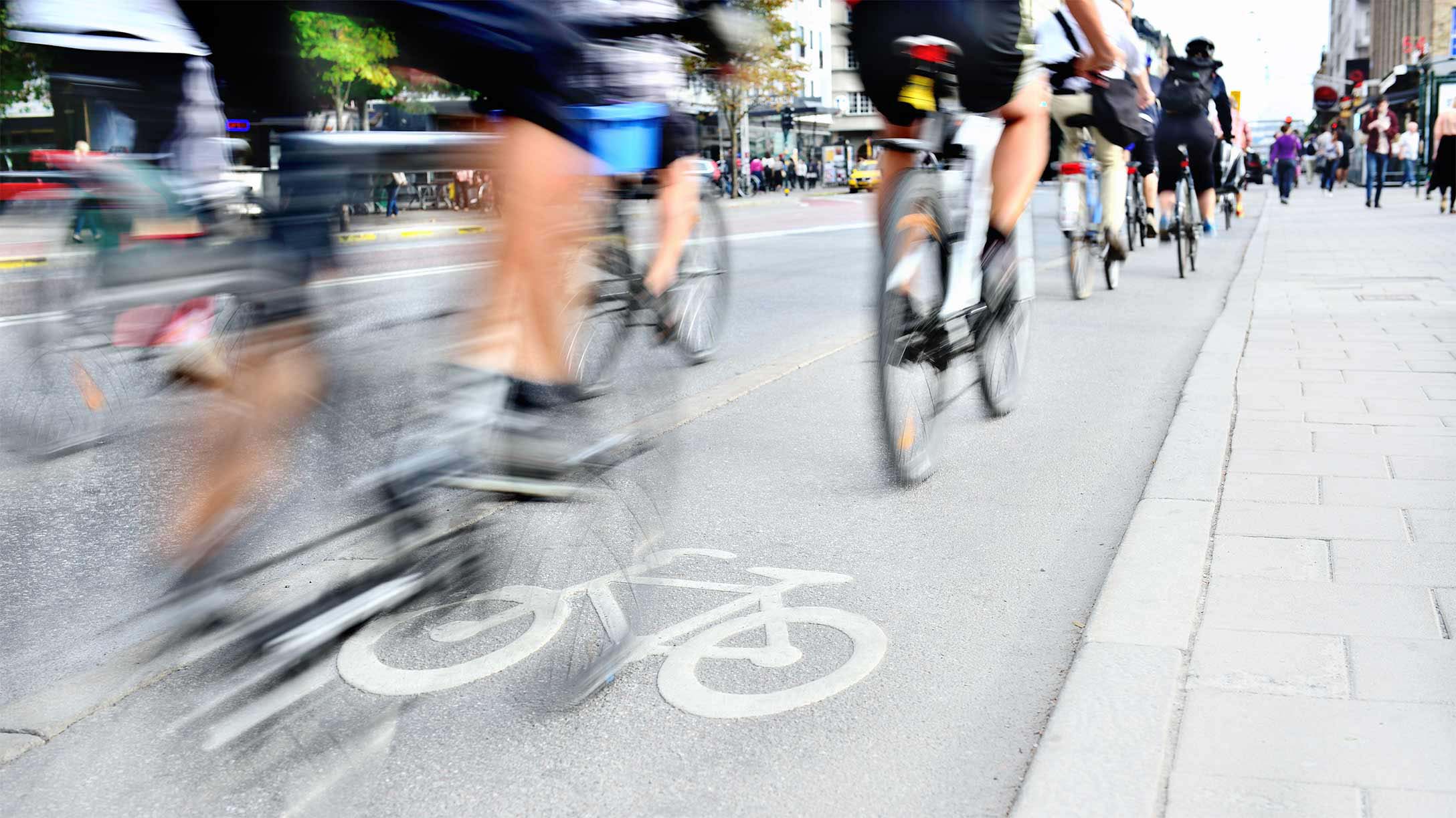 A group of cyclists in a bike line