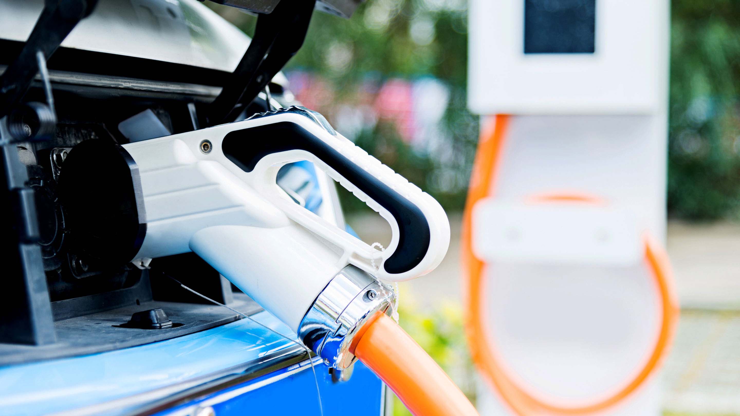 Electric vehicle being charged at a electric vehicle charge station