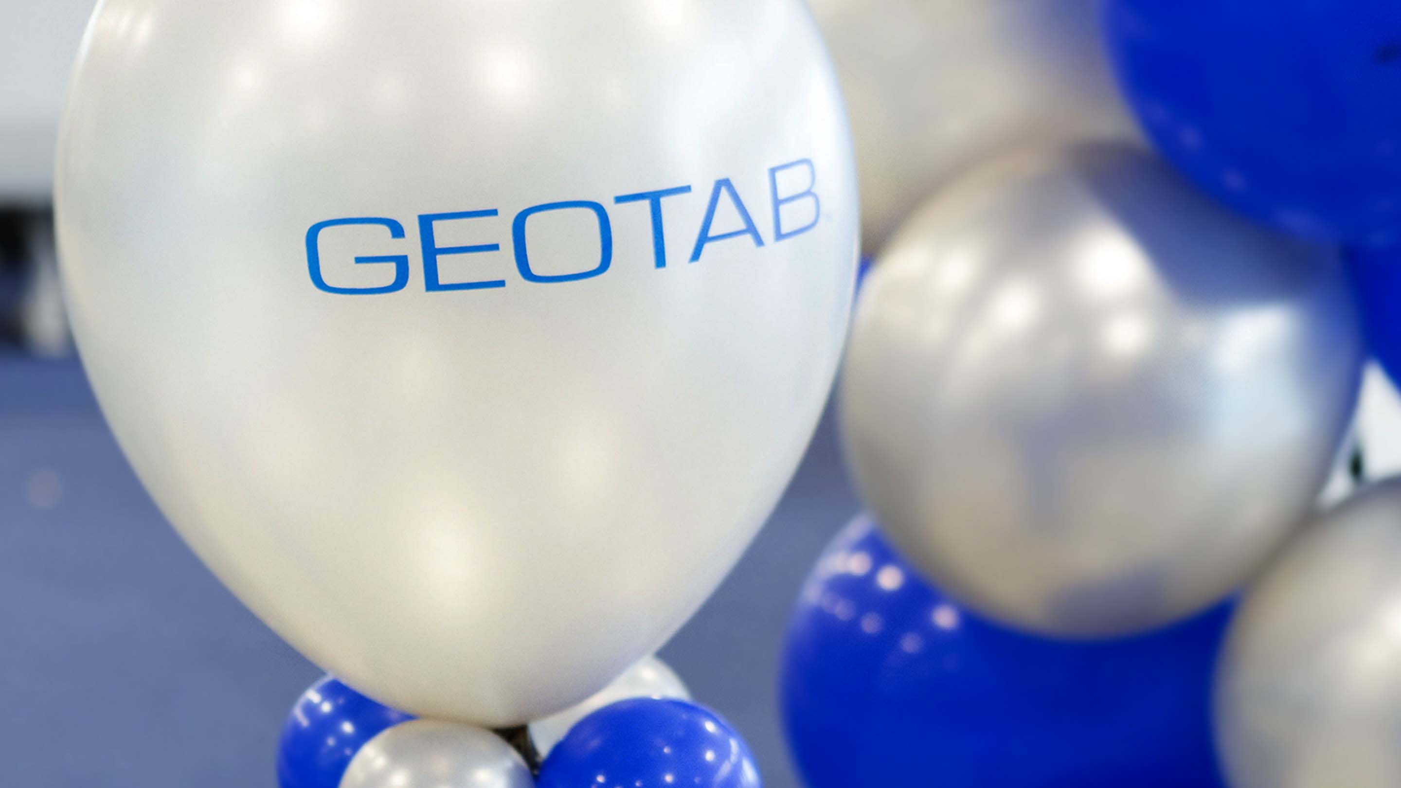 Balloons with Geotab logo on them