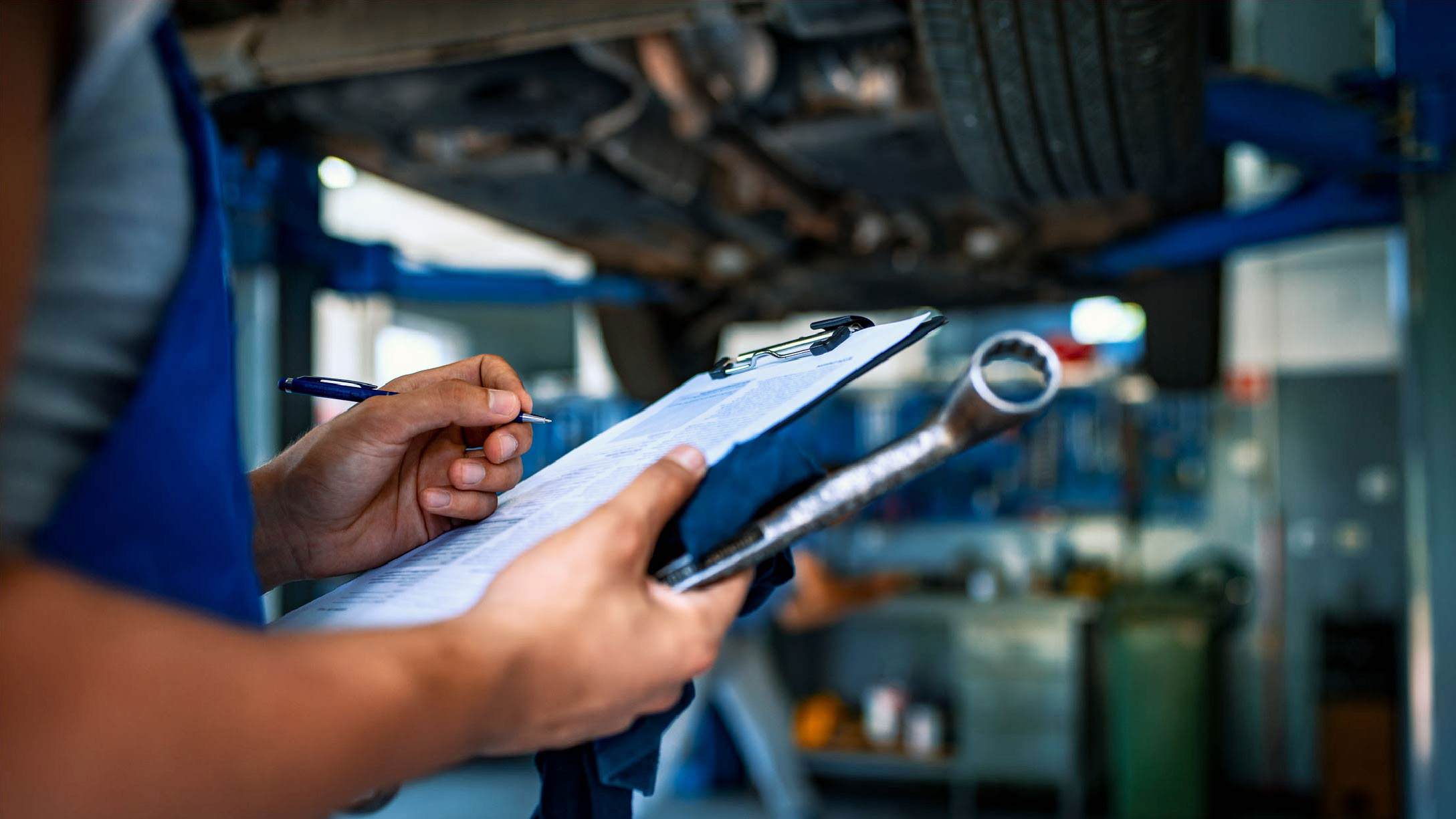 Mechanic holding a checklist