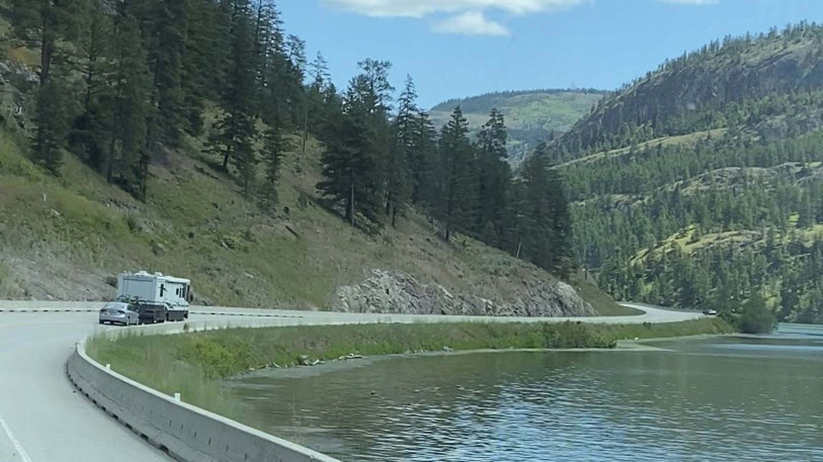 Truck and car driving on road