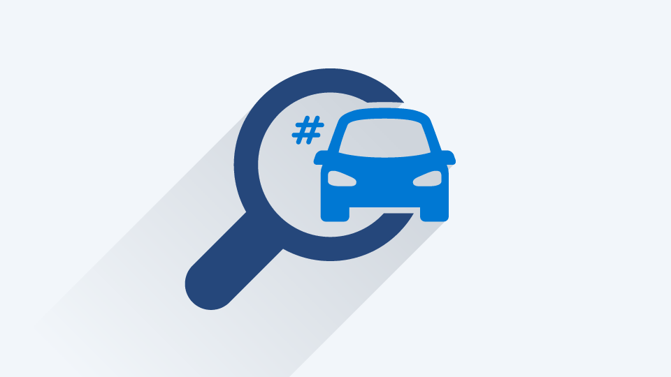 Graphic of a black magnifying glass over a black vehicle