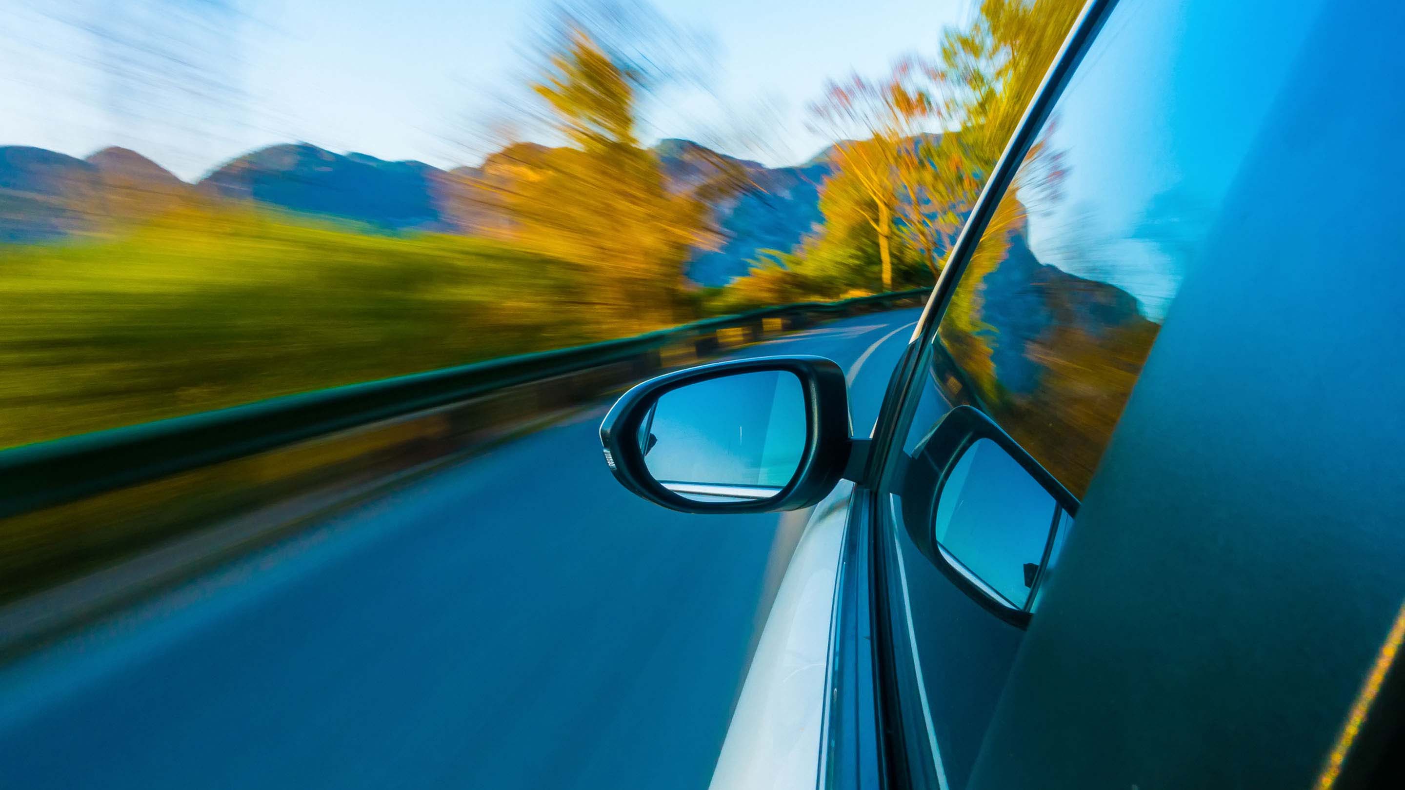 Side view of a car driving