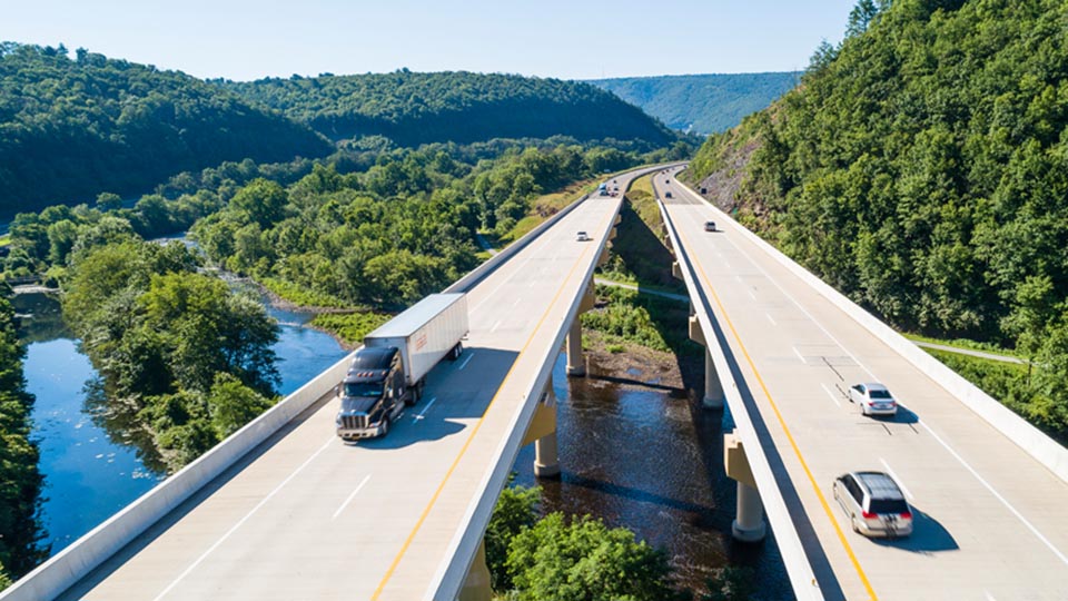 Aerial view of a highway over a forest