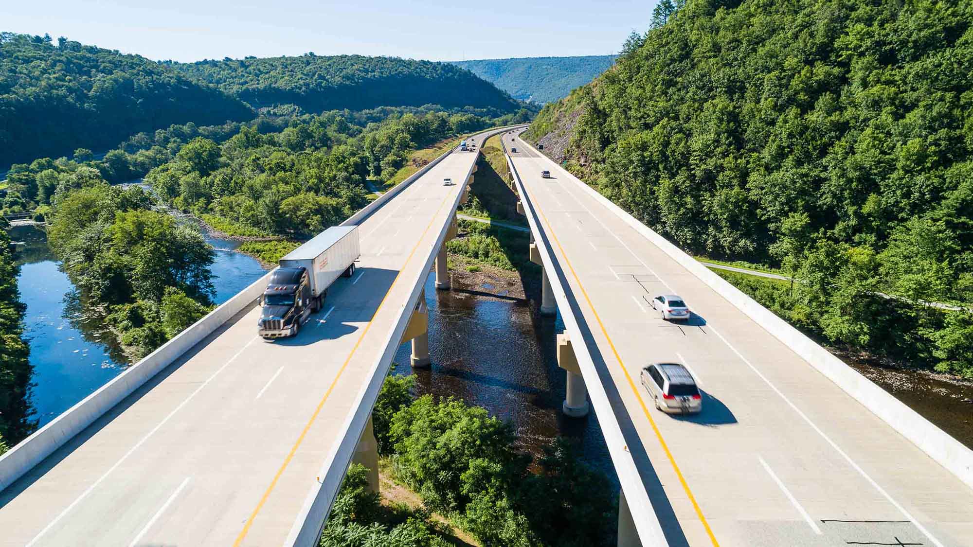 Aerial view of a highway over a forest