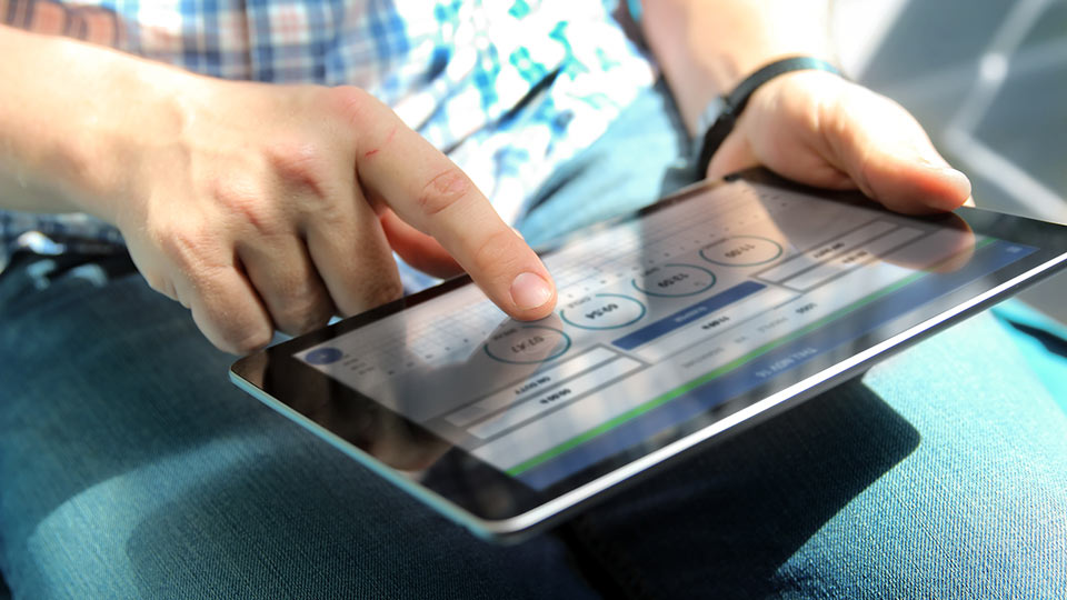 A man using an ELD on a tablet.