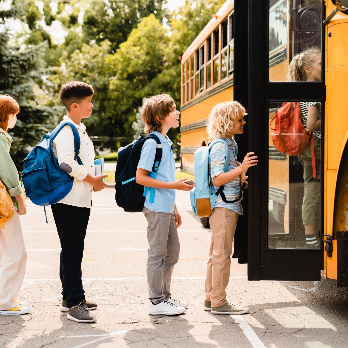 Image of students getting on school bus