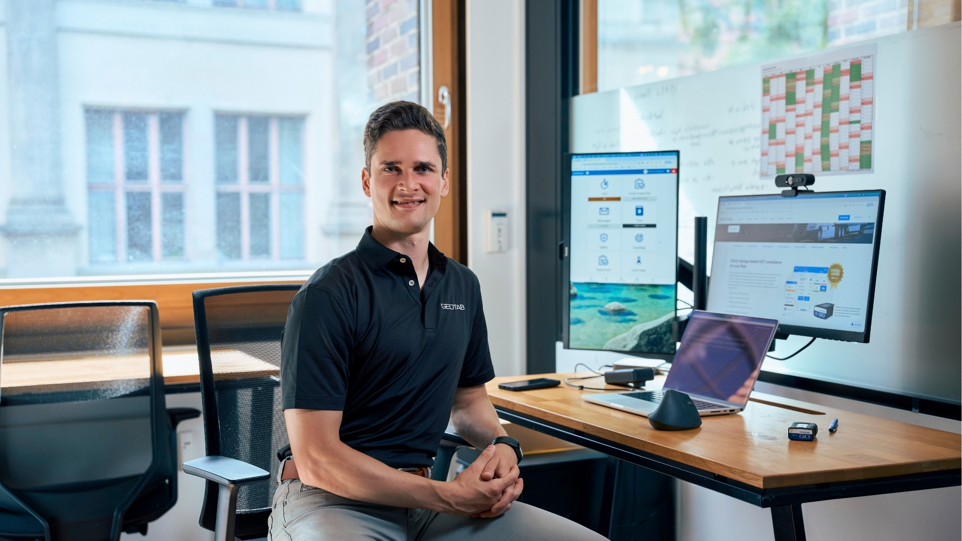 Radu sitting at his desk in the Aachen office