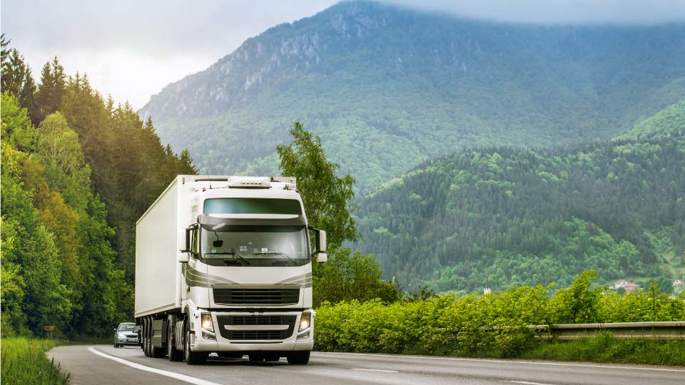 heavy goods vehicle driving on mountain road