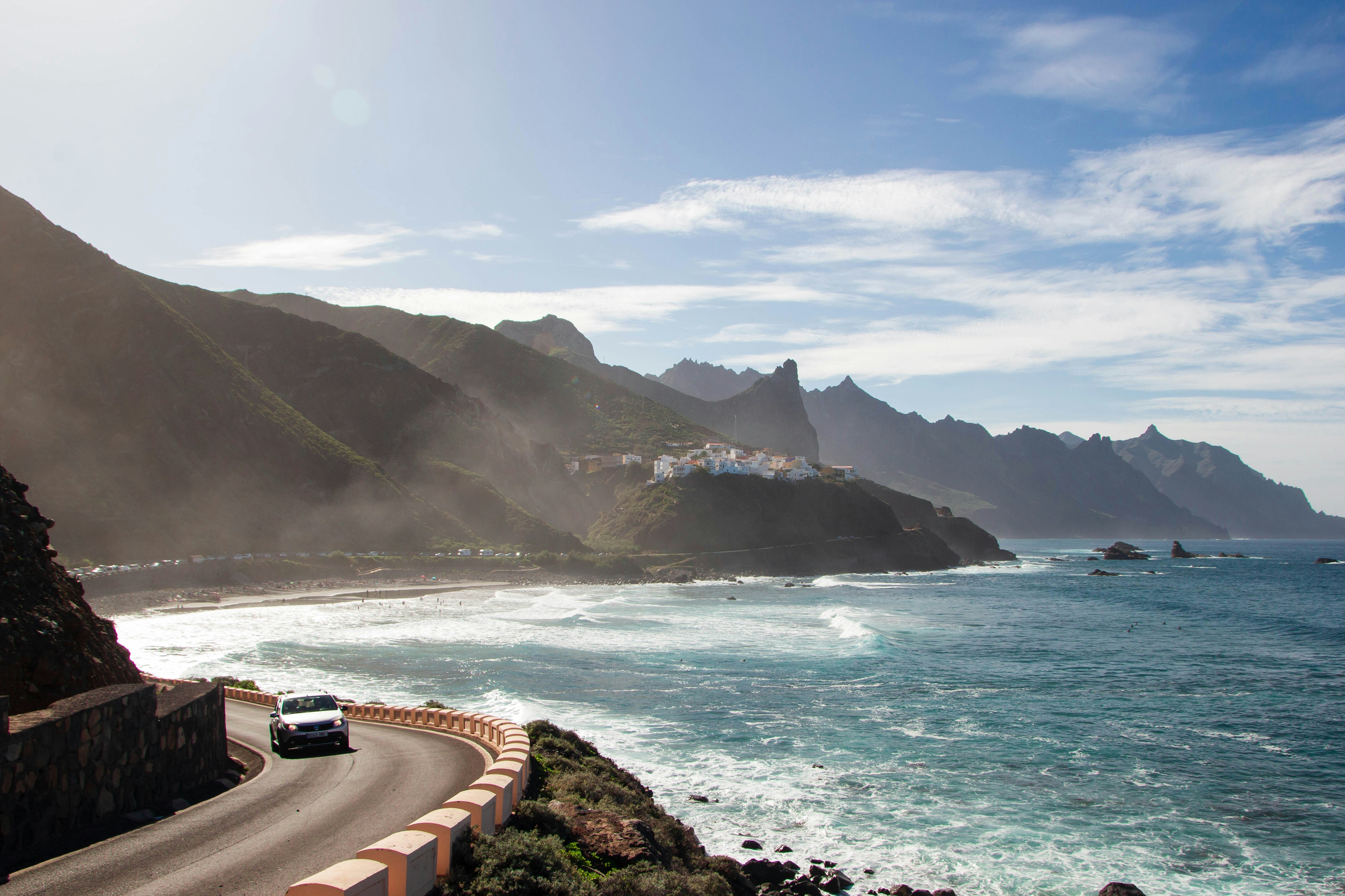 Street in Canarias close to the ocean with a car driving