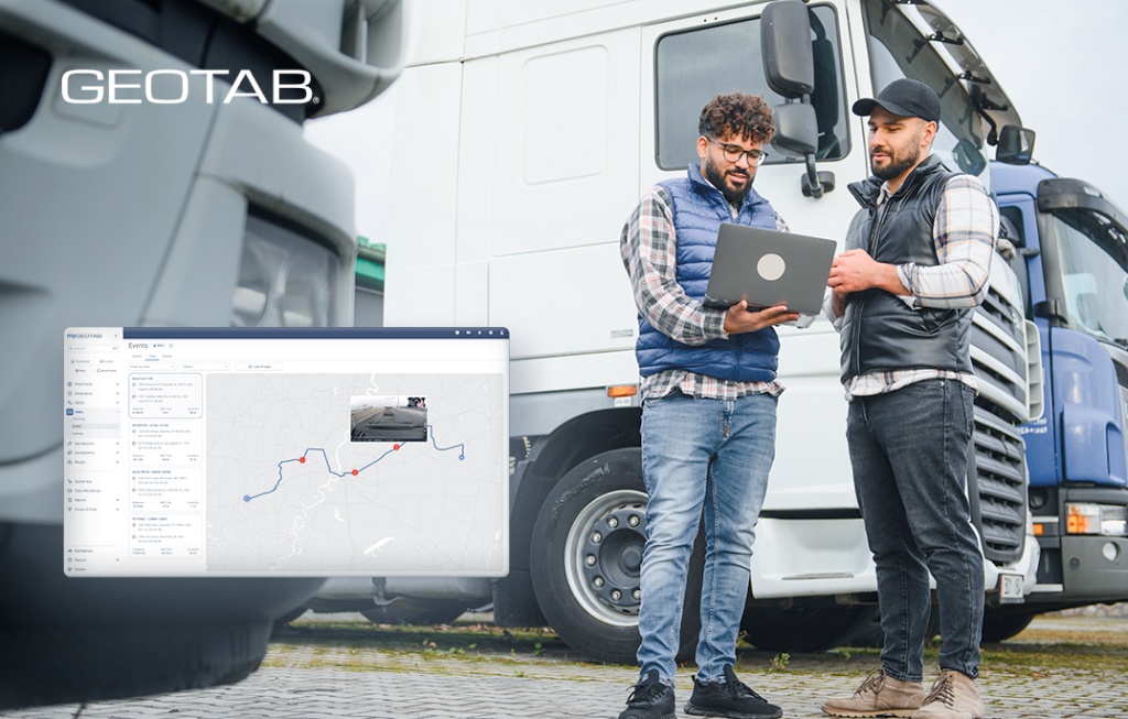 Gestor de flota y operador analizando eventos de video telemática en MyGeotab frente a camiones de carga.