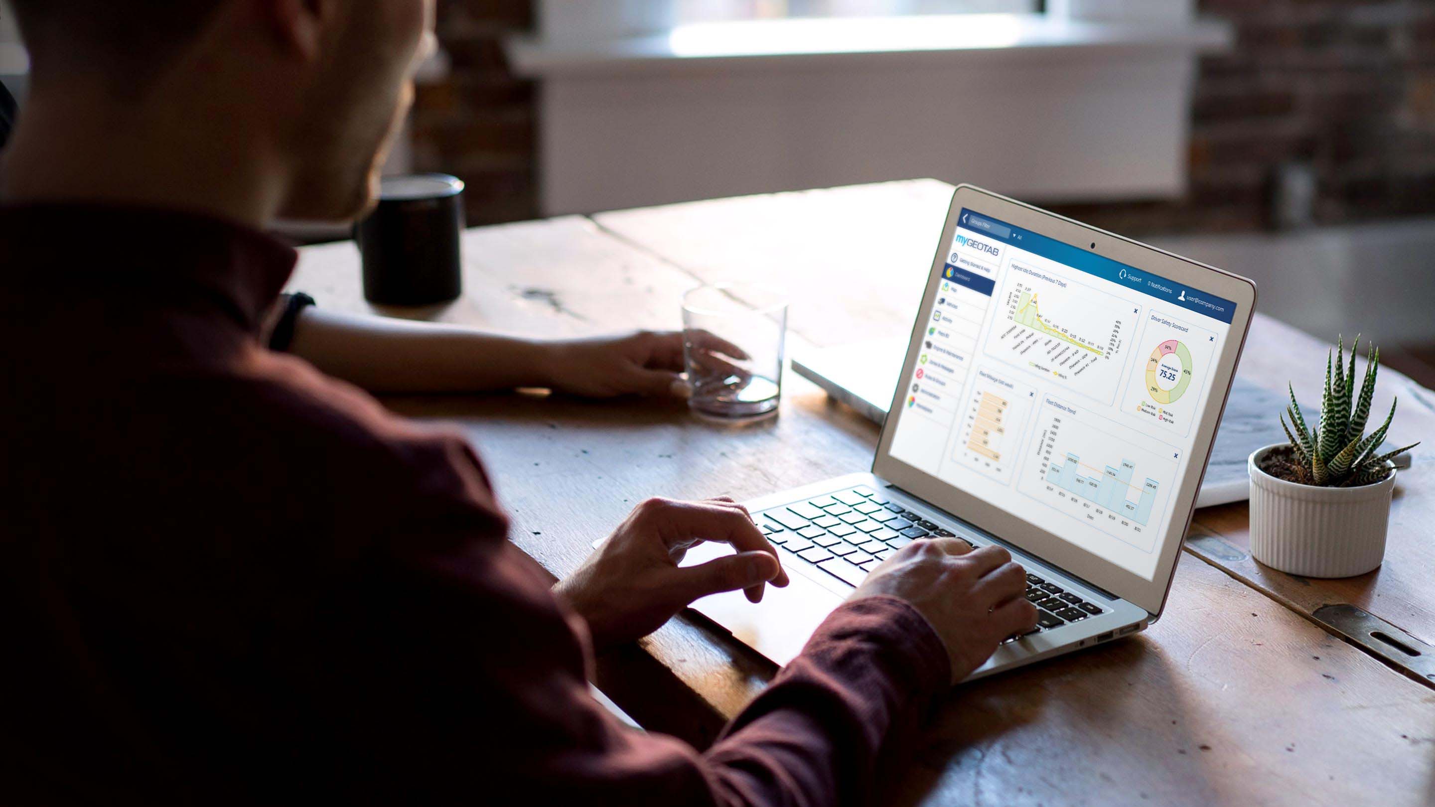 Person using MyGeotab Dashboard on their laptop