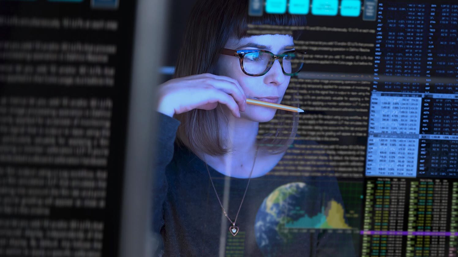 person coding at a desk