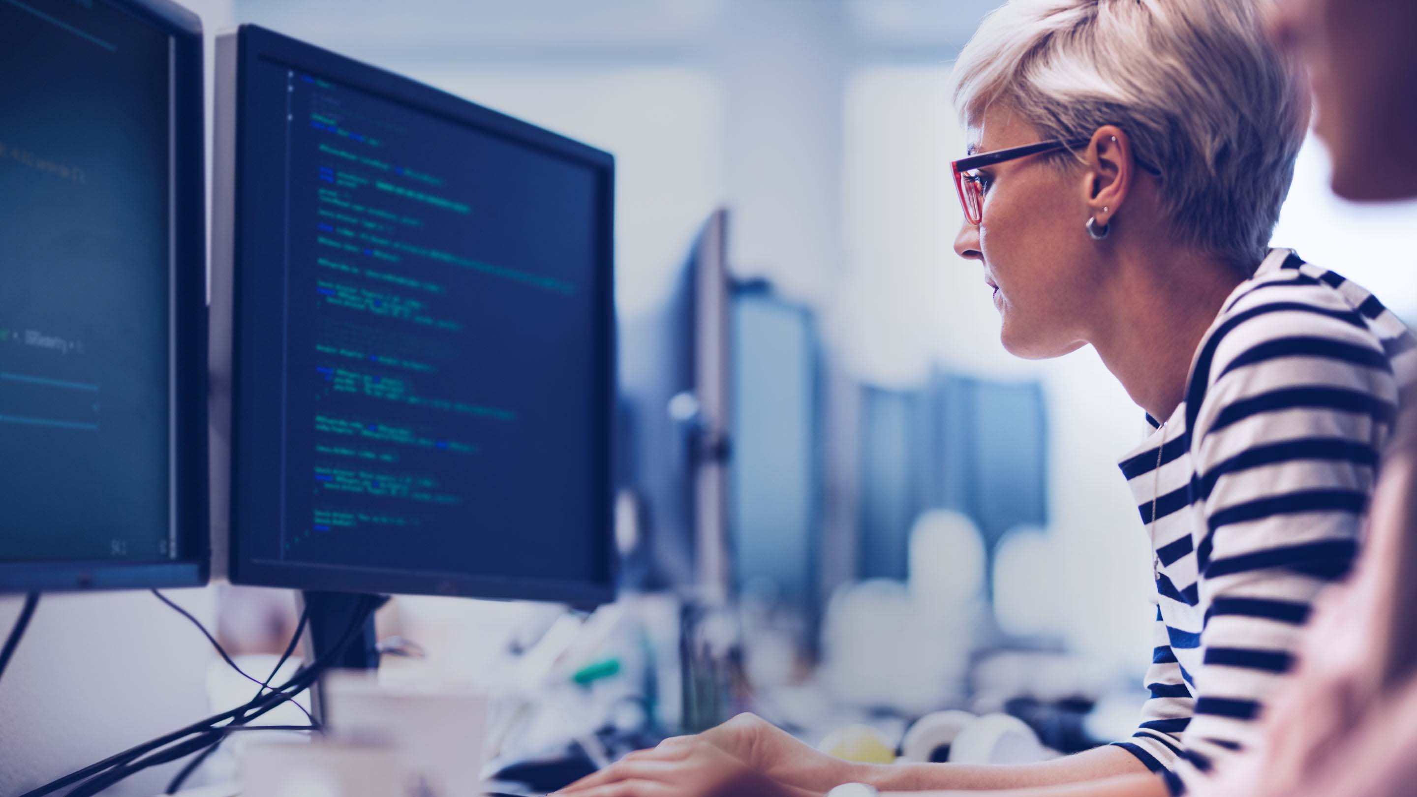 person using computer at a desk