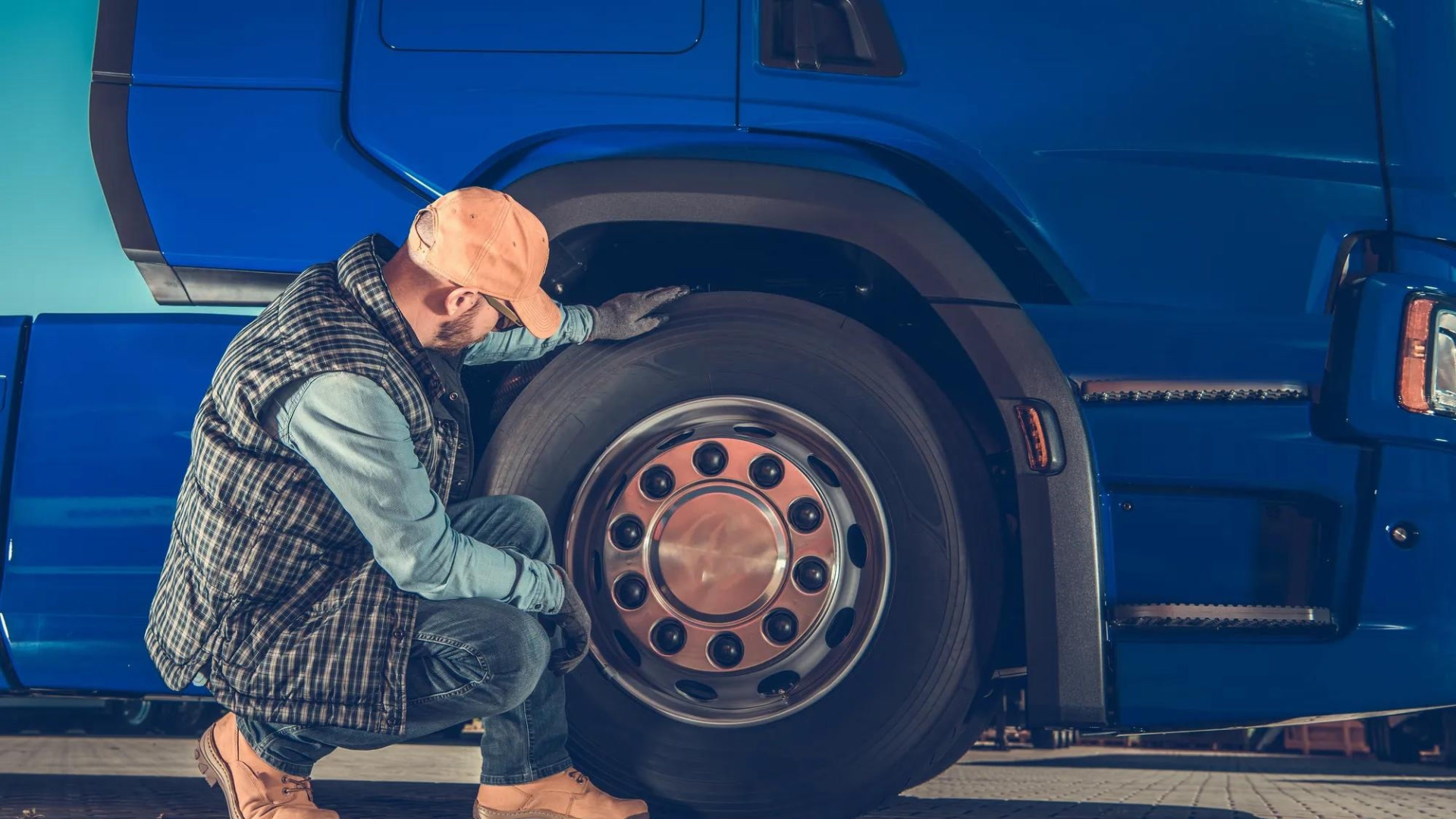 person looking at a tire