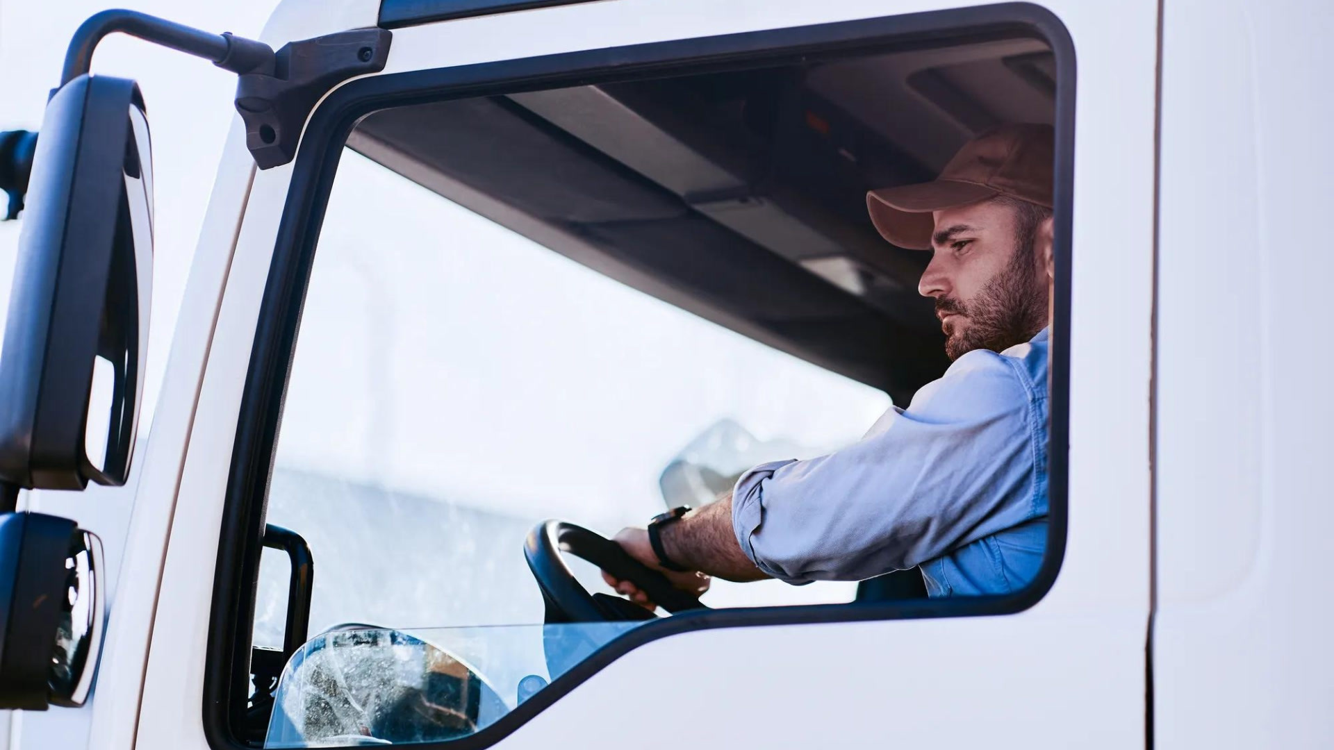 truck driver sitting in the drivers seat