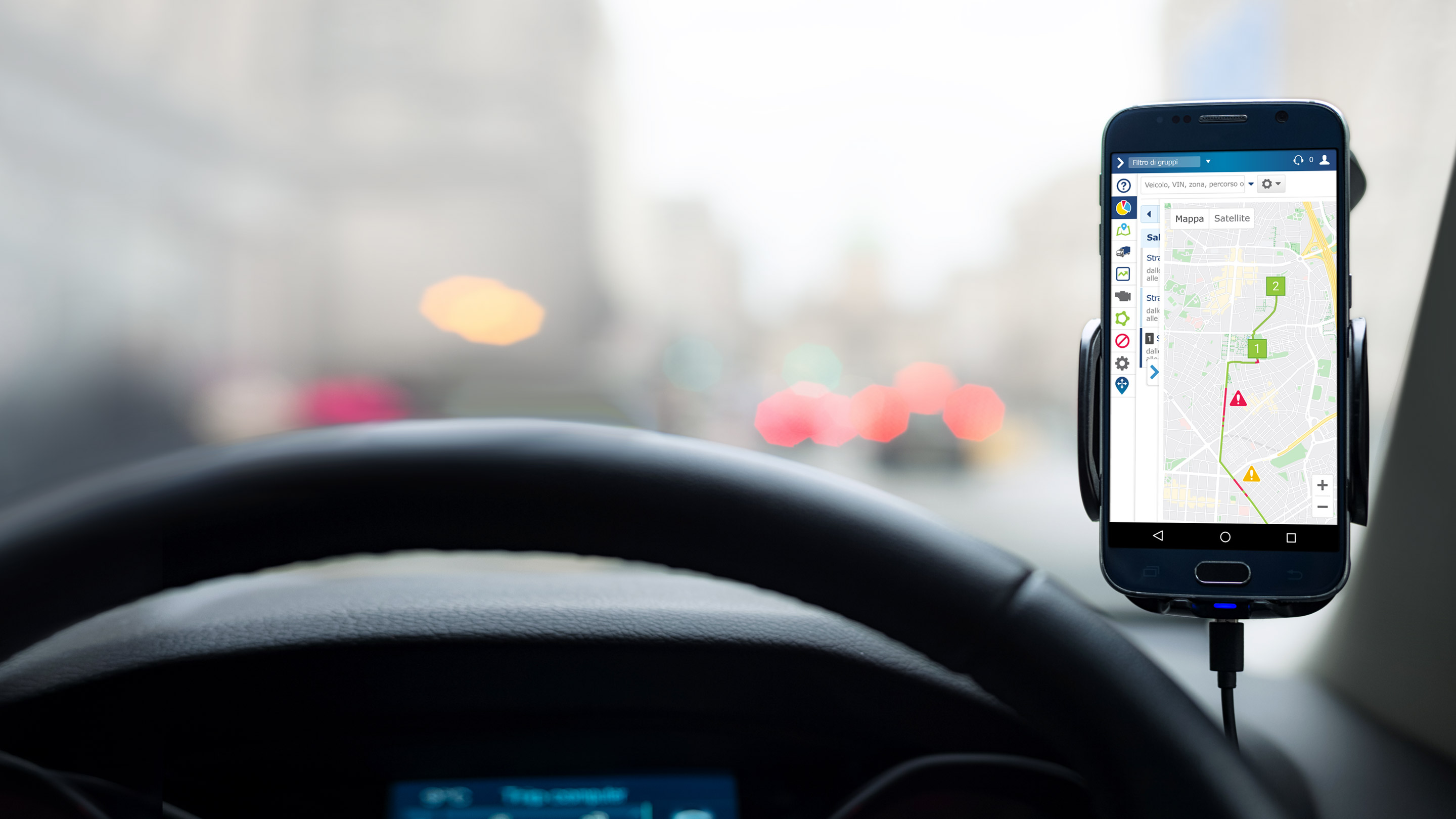 Phone mounted into inside of car displaying a map for routing on MyGeotab. 