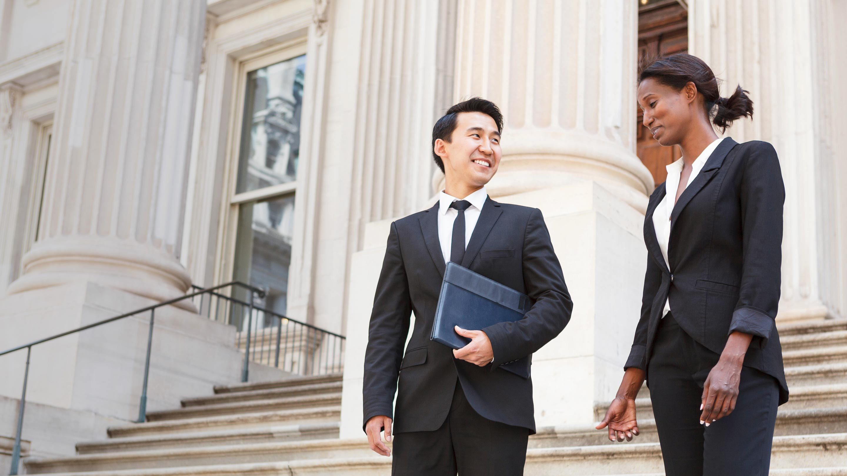 two government employees having a conversation