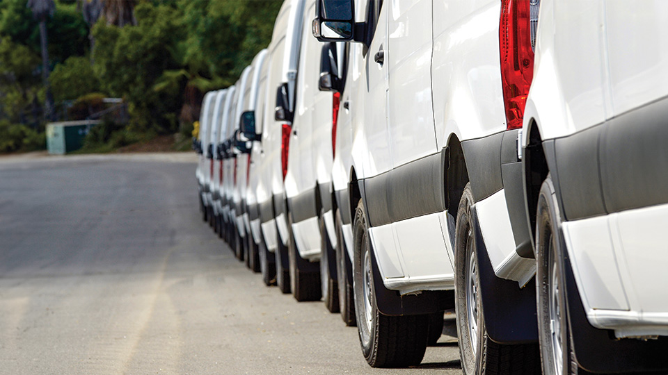 fleet of vans parked together