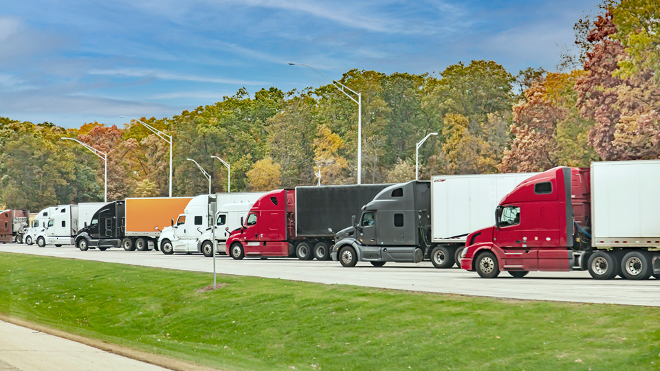 Row of large trucks parked together