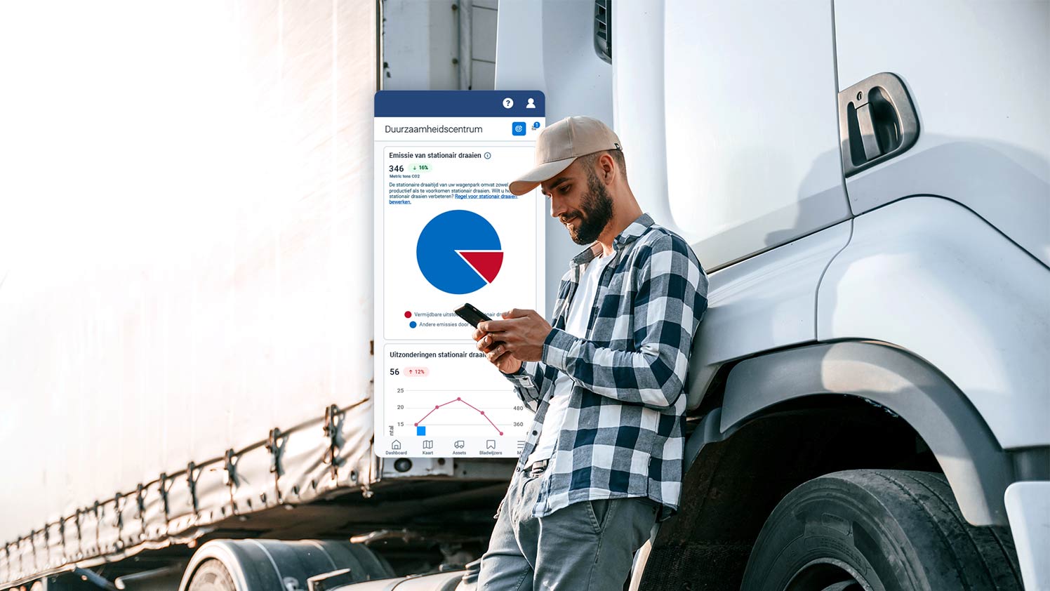 Persoon naast een vrachtwagen met MyGeotab op telefoon
