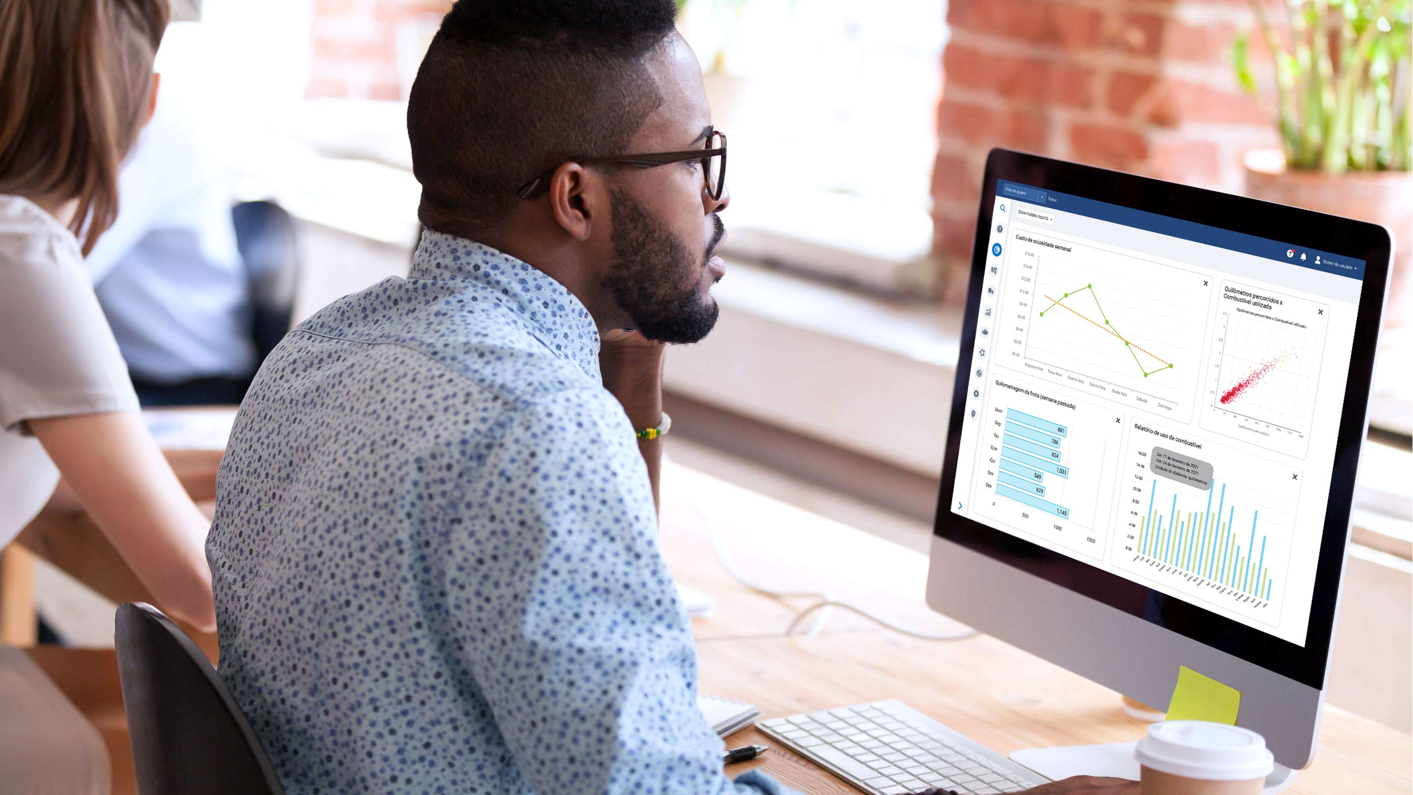 Man using MyGeotab interface on desktop computer