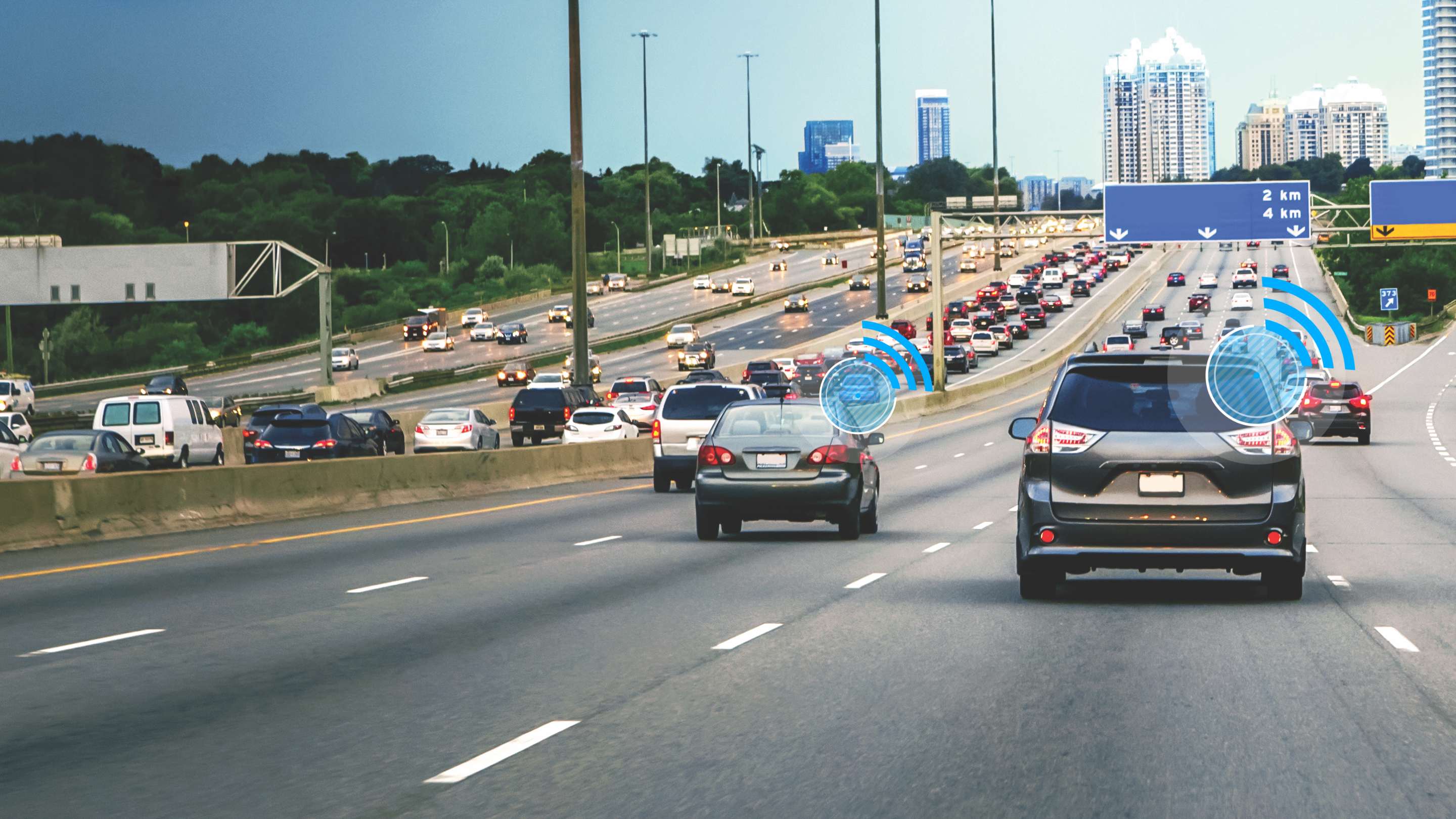 Image of cars driving on a highway with connected illustrations 