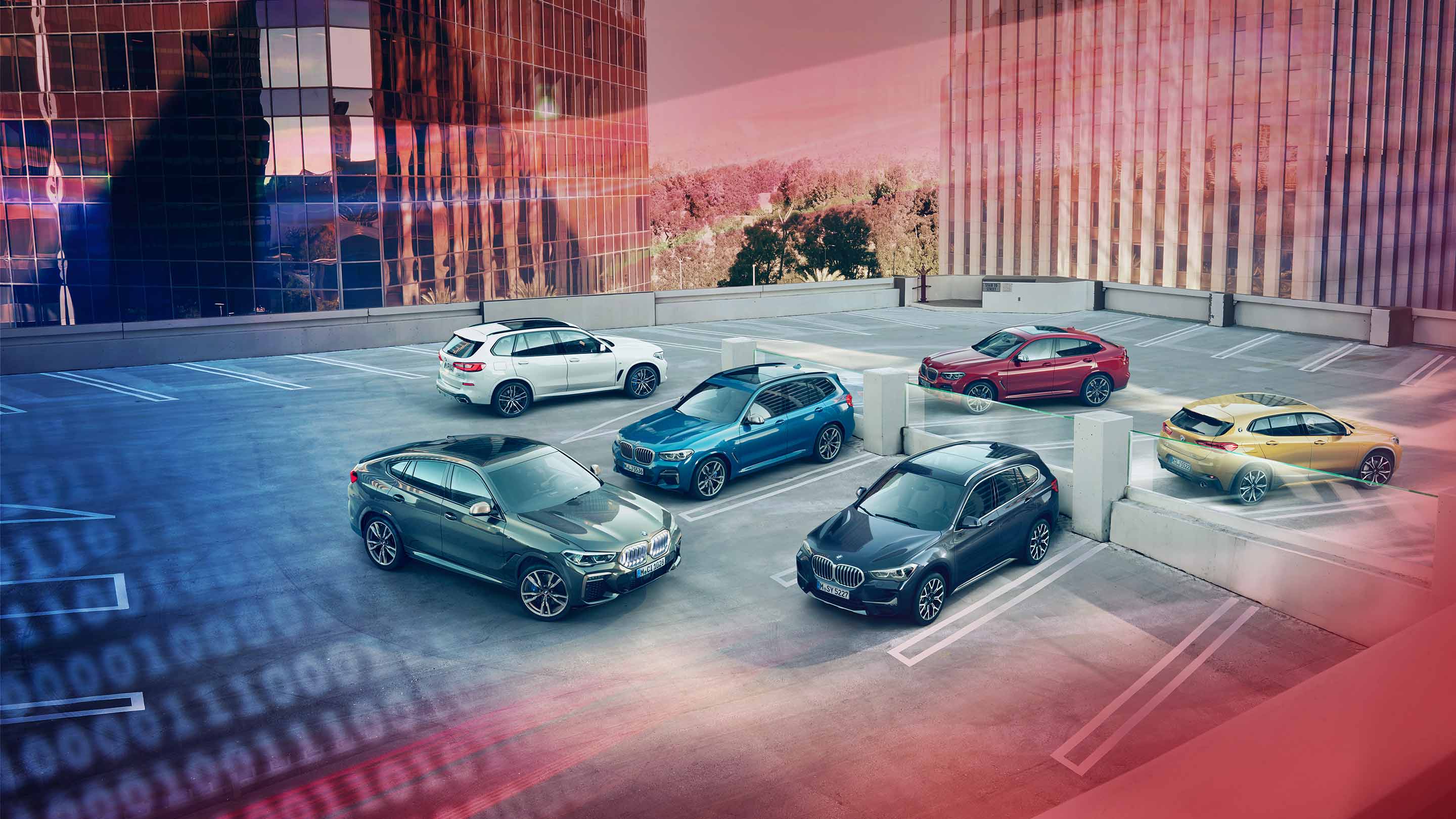 Aerial view of bmw cars parked on rooftop parking