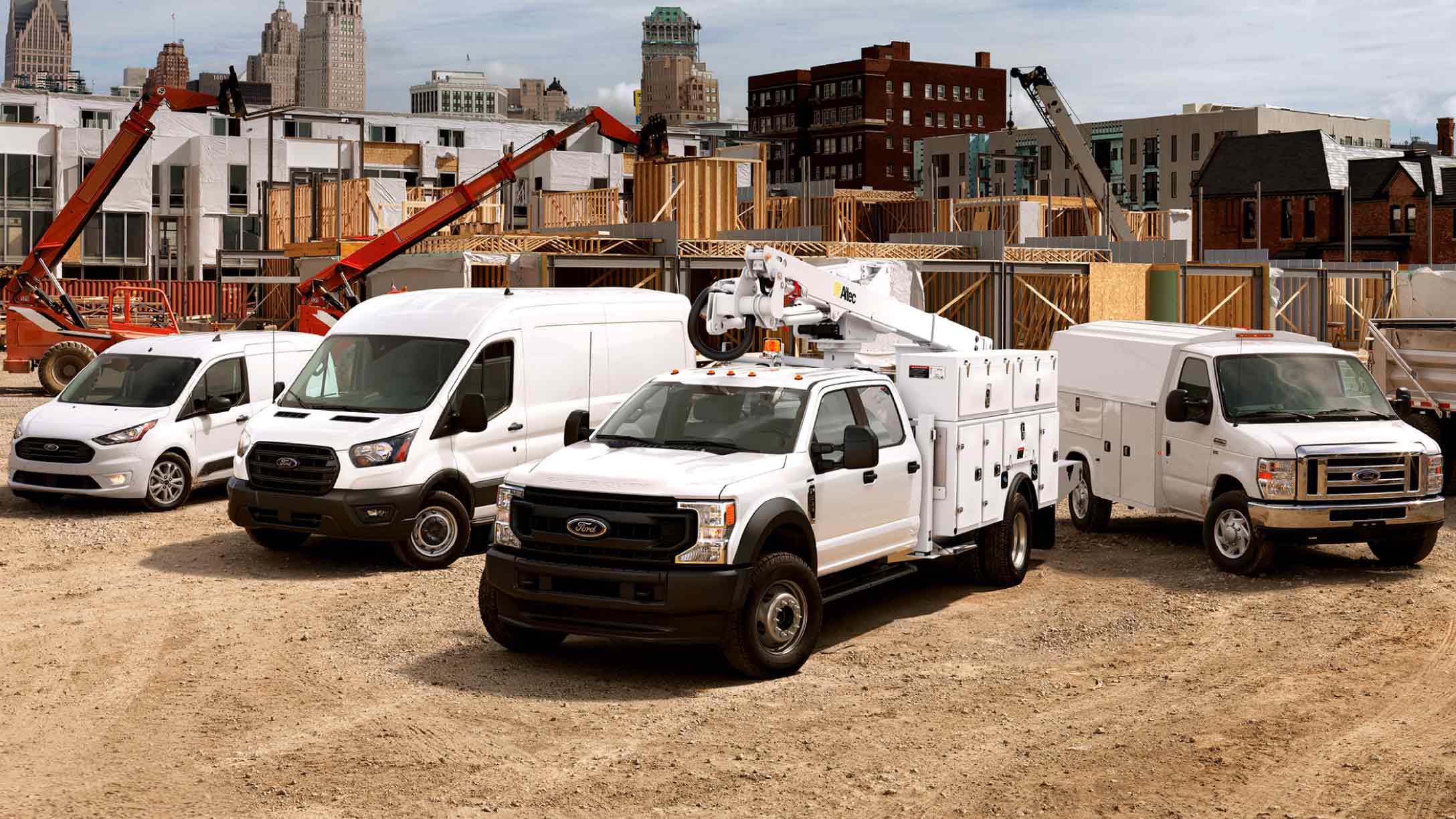 White Ford vehicles at a construction site