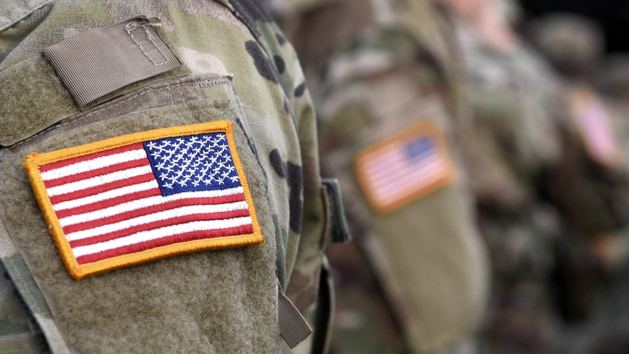 Close up an American flag patch on the arm of an American solider 