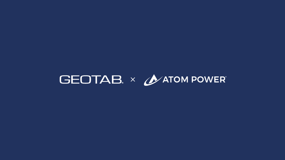 Dark navy blue background with Geotab and Atom Power's logo