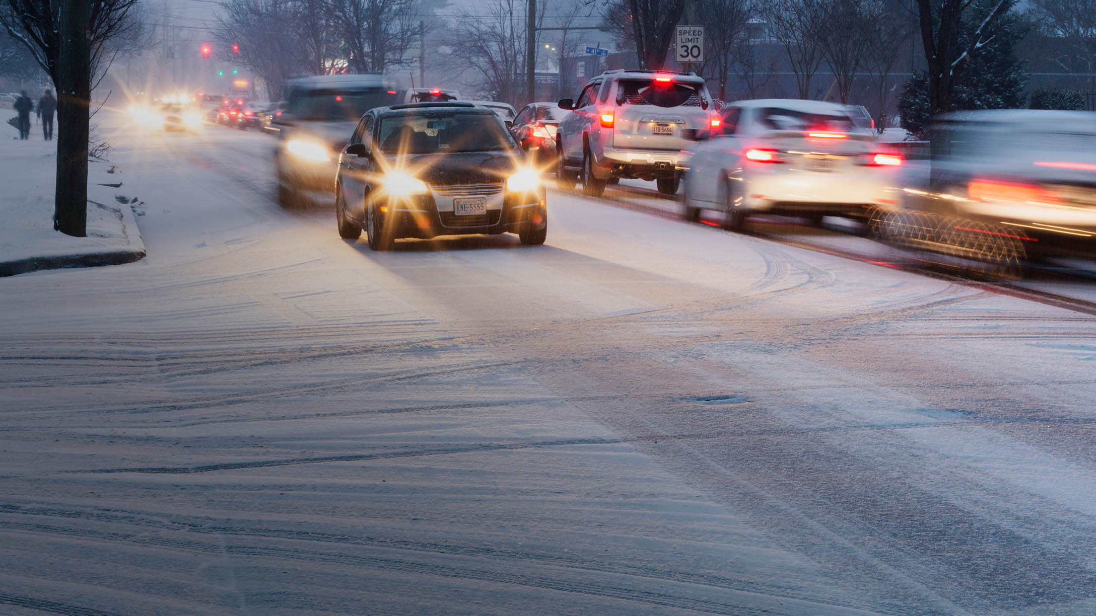 Cars travelling both ways on a snowy road