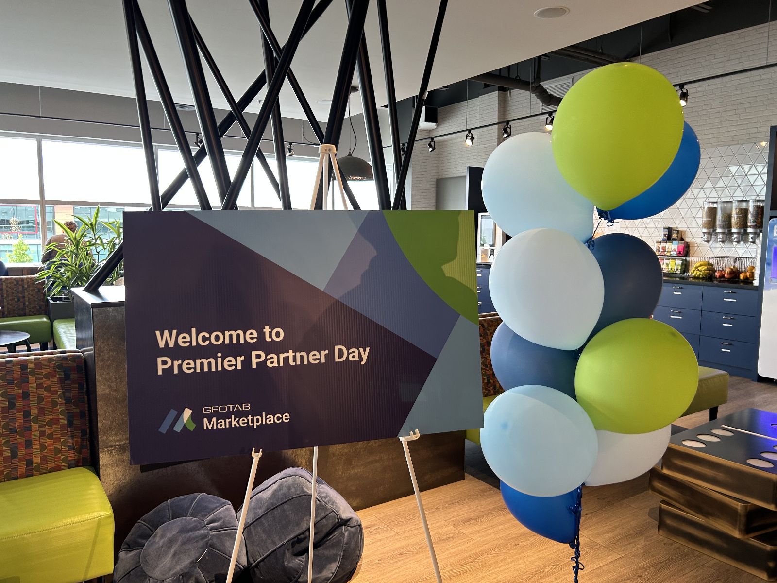 Marketplace Premier Partner Day sign with balloons 