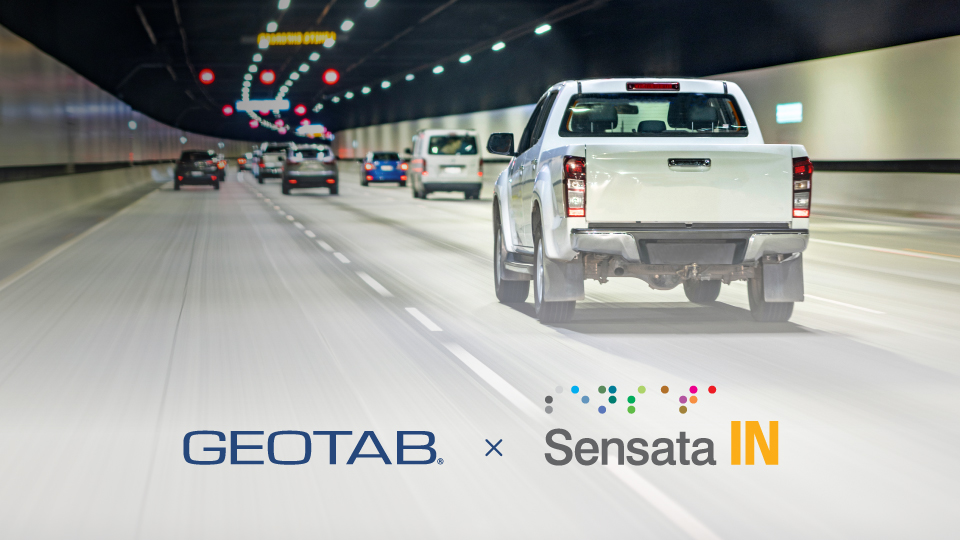 White pick-up truck driving with Geotab and Sensata Insights logo