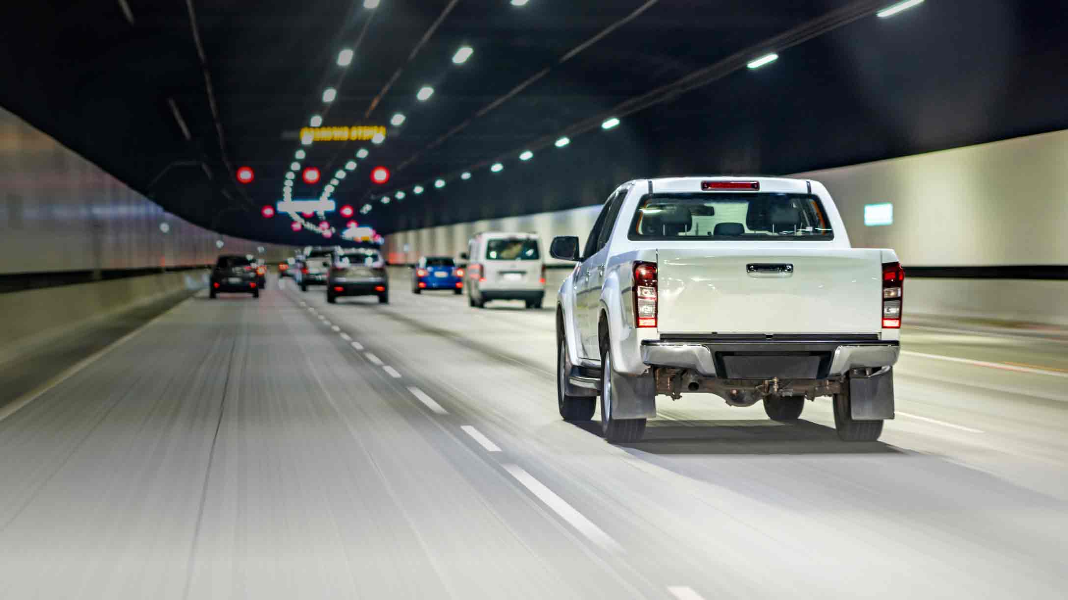 White pick-up truck driving with Geotab and Sensata Insights logo