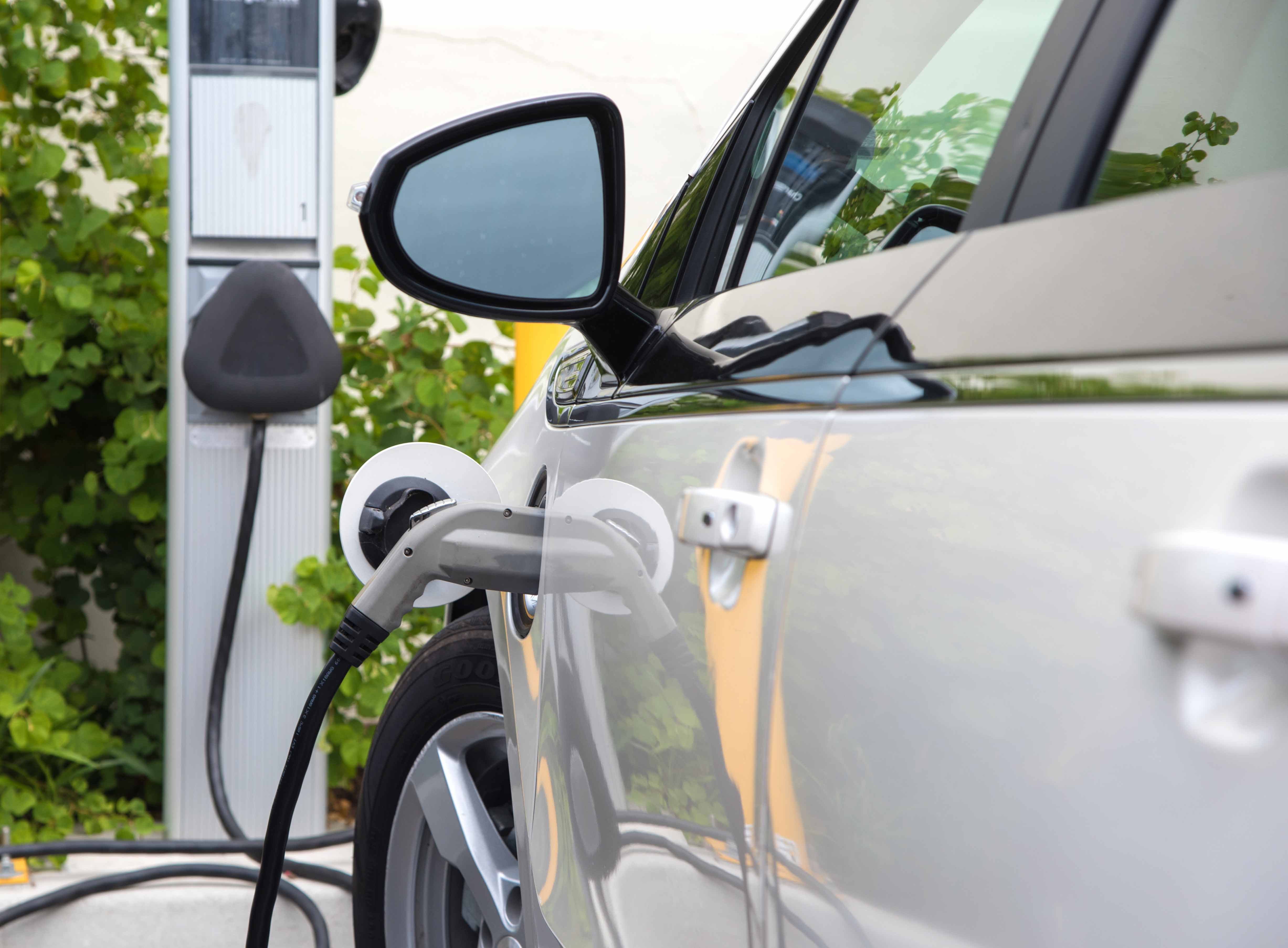 car at electric charging station